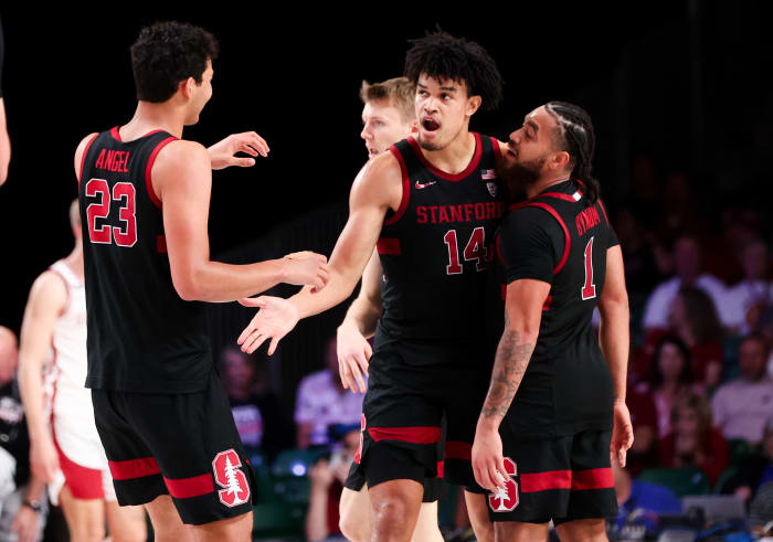 Nov 22, 2023; Paradise Island, BAHAMAS; Stanford Cardinal forward Spencer Jones (14) celebrates with Stanford Cardinal forward Brandon Angel (23) and Stanford Cardinal guard Jared Bynum (1) during the second half against the Arkansas Razorbacks at Imperial Arena. Mandatory Credit: Kevin Jairaj-USA TODAY Sports